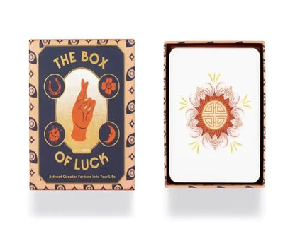 Tarot card deck box: dark blue cover with peace-hand symbol and "The Box of Luck"