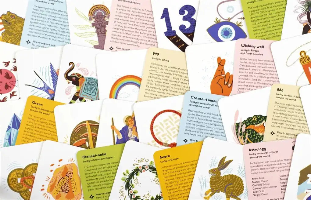 Scattered spread of illustrated tarot cards with a visible "13" card and symbols