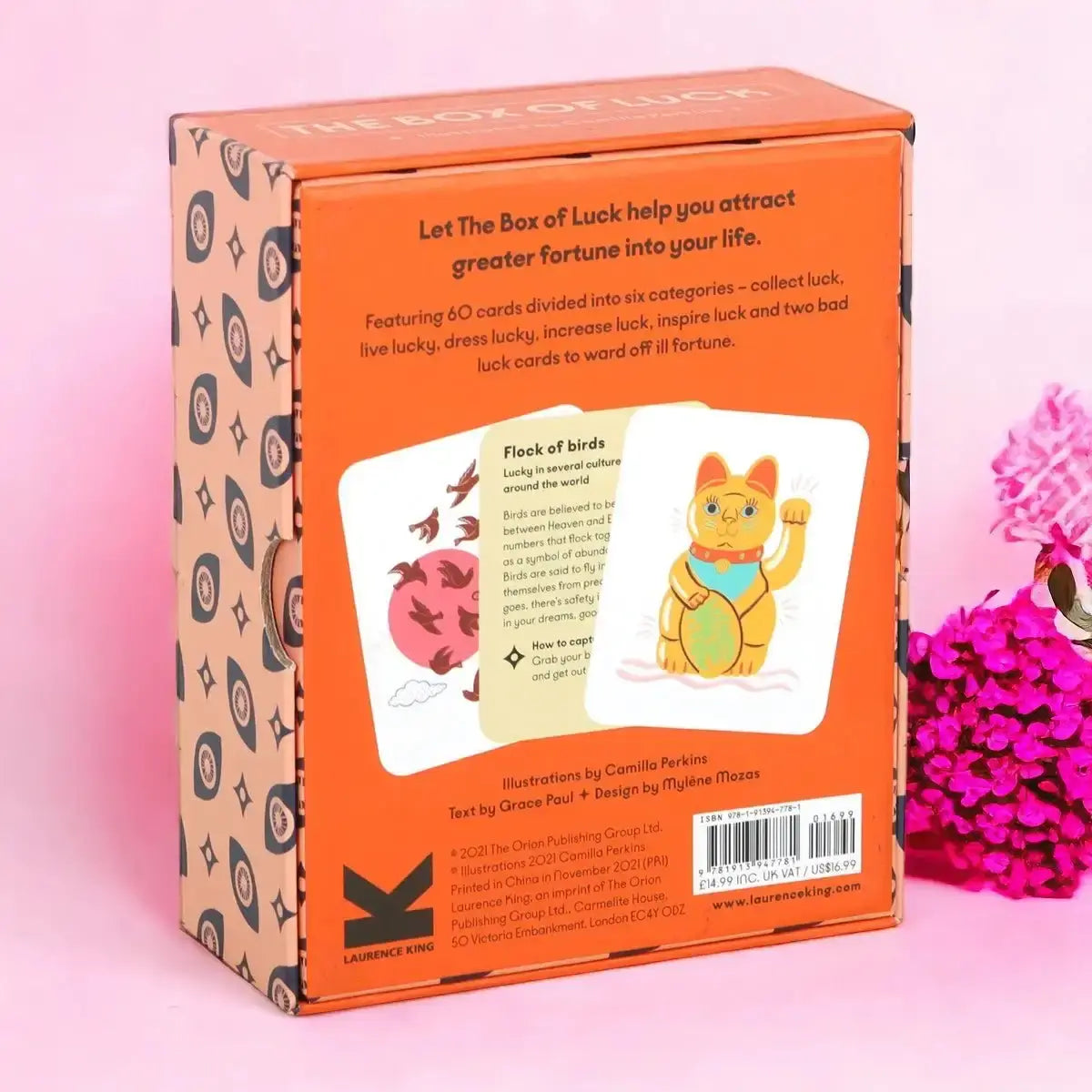 Tarot card deck box back panel with orange section and illustrated card artwork