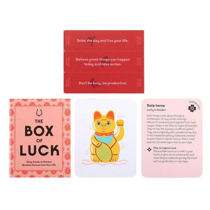 Tarot card deck packaging with illustrated cards laid out in a small grouping