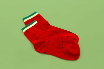 Watermelon socks, red with seed speckles and green-and-white striped cuff