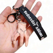 3D keyring charm with black "Wednesday Adams" strap and stitched hand-shaped charm