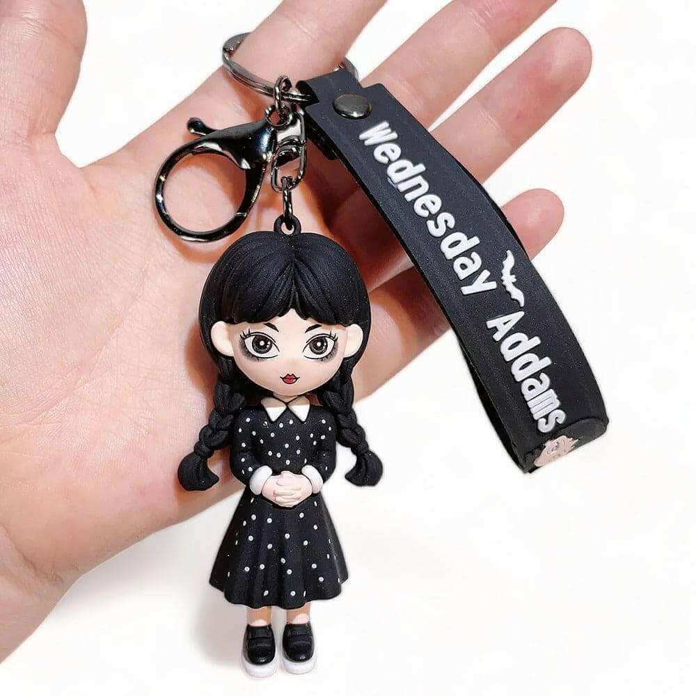 3D keyring charm with one Wednesday-style doll and black "Wednesday Adams" strap