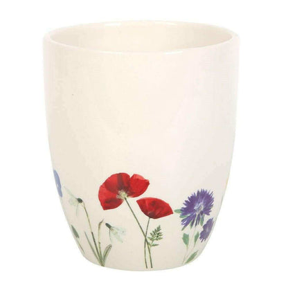White ceramic plant pot with red poppy flowers and purple bloom print