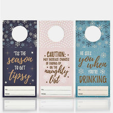 Set of 3 winter bottle gift tags with circular cutouts and mixed seasonal sayings