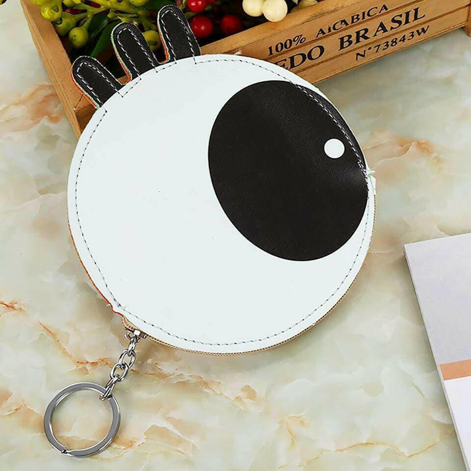 White novelty coin purse with black eyeball graphic and metal keychain ring