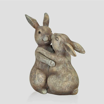 Beige bunny rabbit ornament pair with one hugging the other, textured sculpt details